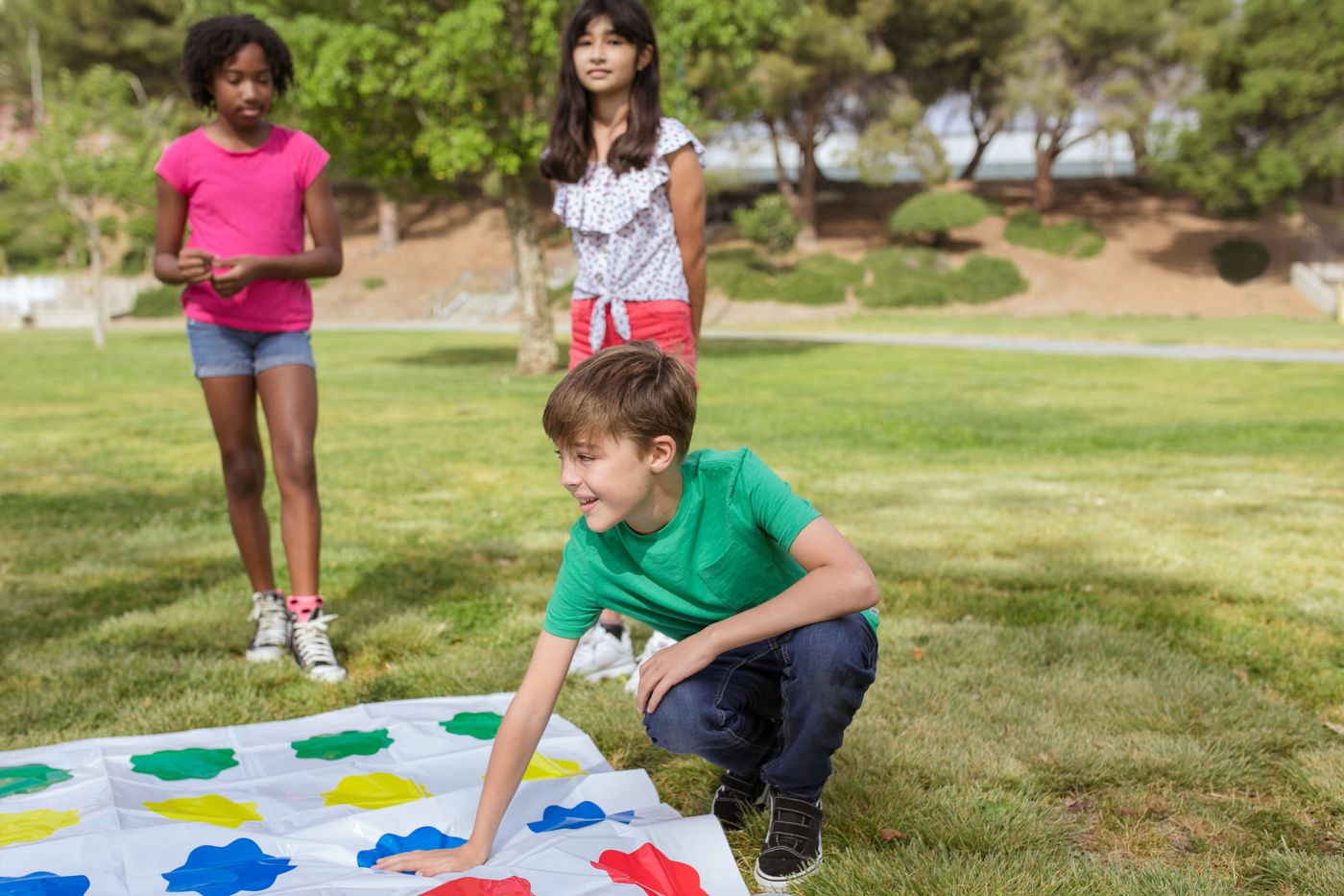Children enjoying a colorful outdoor game in a park